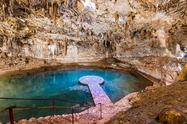 A wide view of the interior of Cenote Suytun with its central platform.